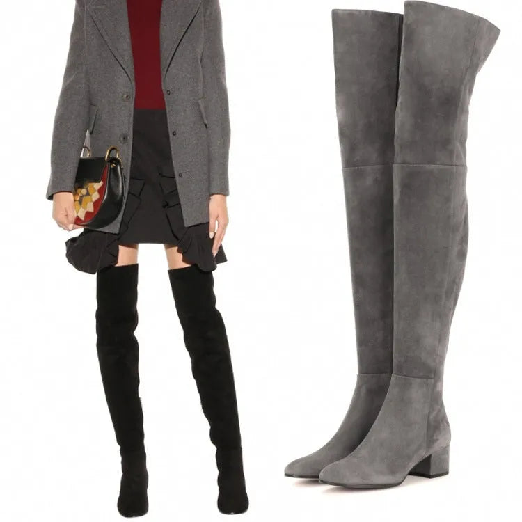 Grey suede women's flat over-the-knee boots with a pointed toe and low thick heel.