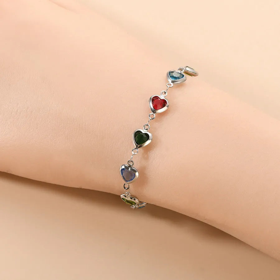 Devil's Eye geometric heart-shaped stainless steel bracelet in an electroplated colour on a wrist.