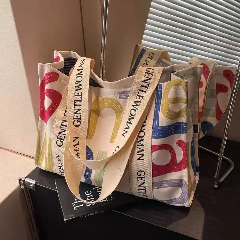 Canvas women's travel tote bag with printing elements and large capacity design