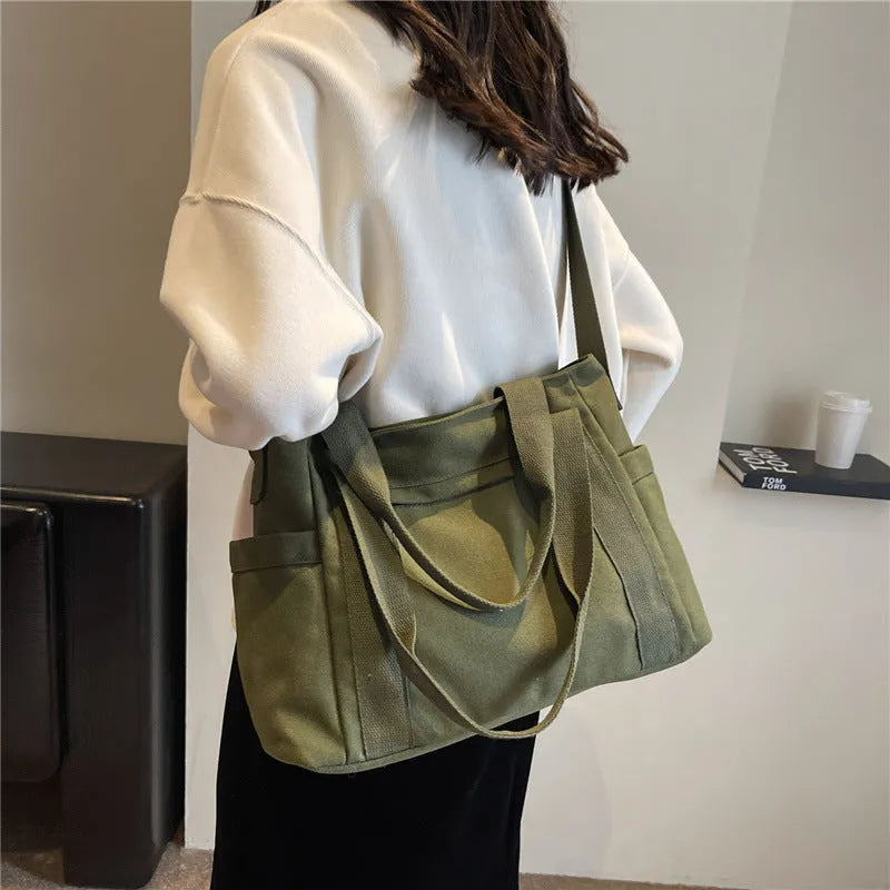 Polyester shoulder bag for women with phone compartment and sandwich pockets in solid colour options