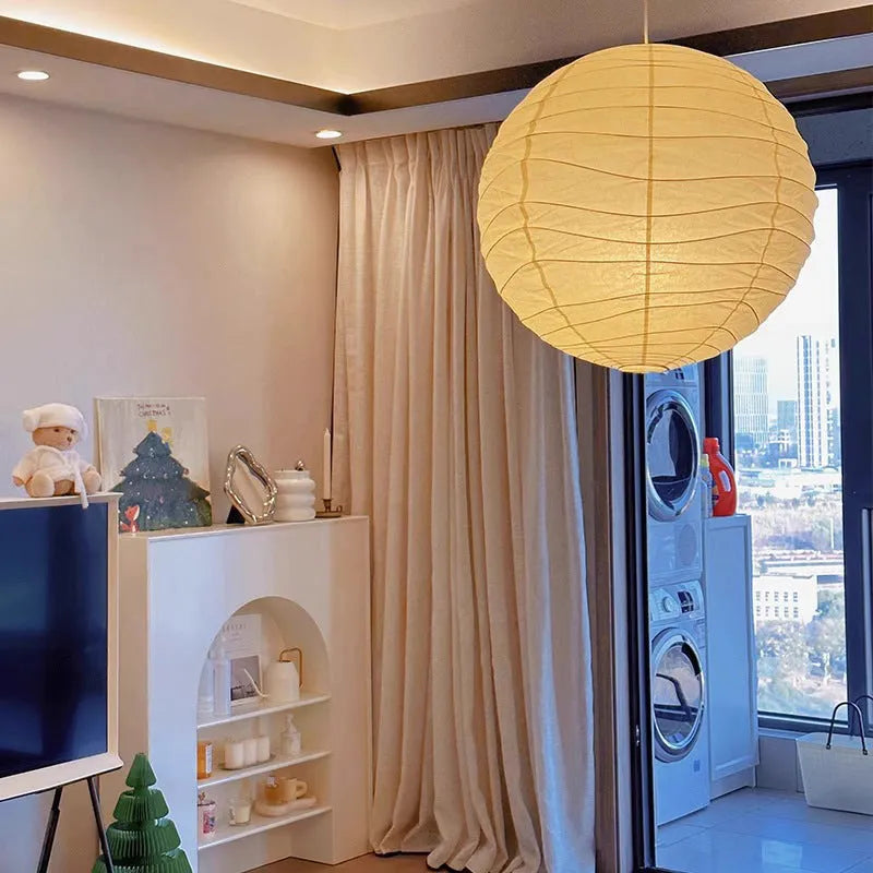 Japanese style spherical rice paper ball chandelier pendant light with warm glow.