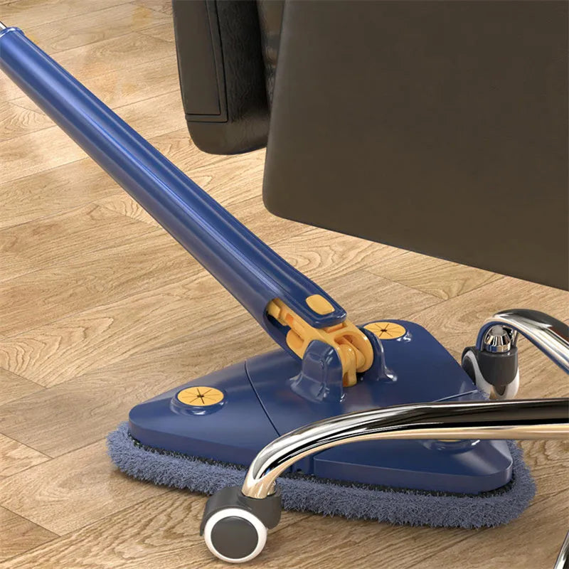 Blue extendable triangle mop with rotating head and microfibre cloth on a tiled floor.