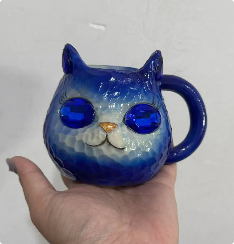 Resin crystal earth cat cup craft ornament in American style, shown in blue, green, pink, and purple colour options.
