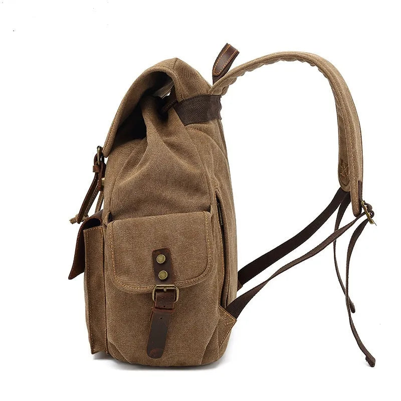 Retro-style army green canvas backpack with antique bronze hardware, shown closed.