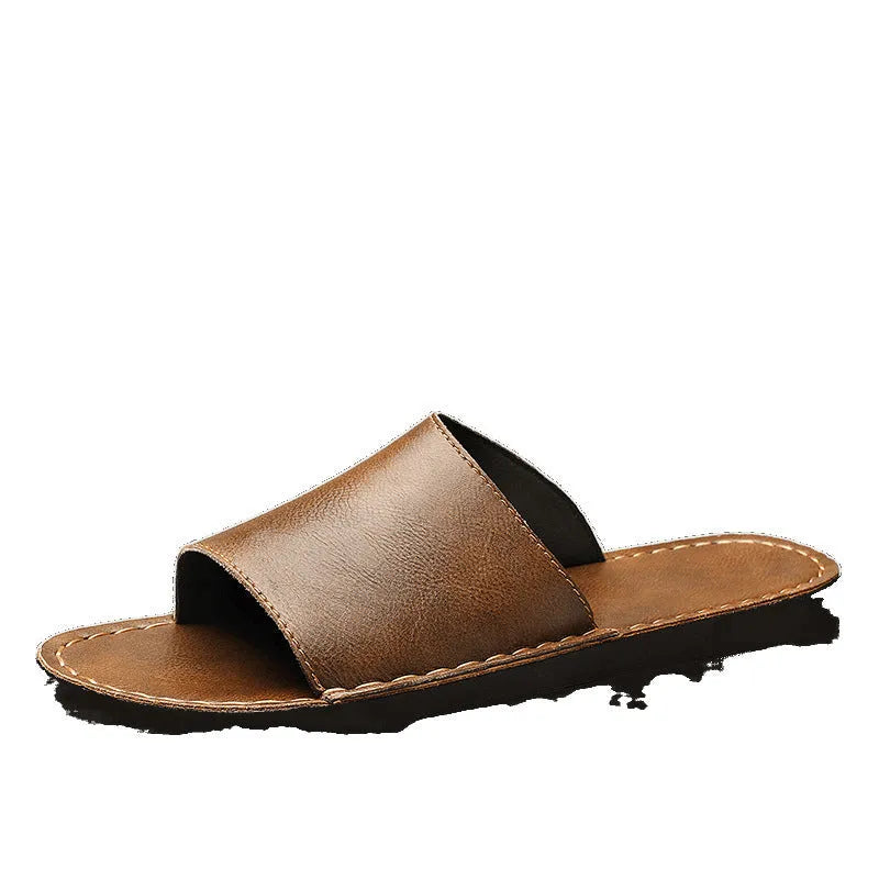 Brown and black men's outdoor leather sandals with rubber soles on a neutral background.