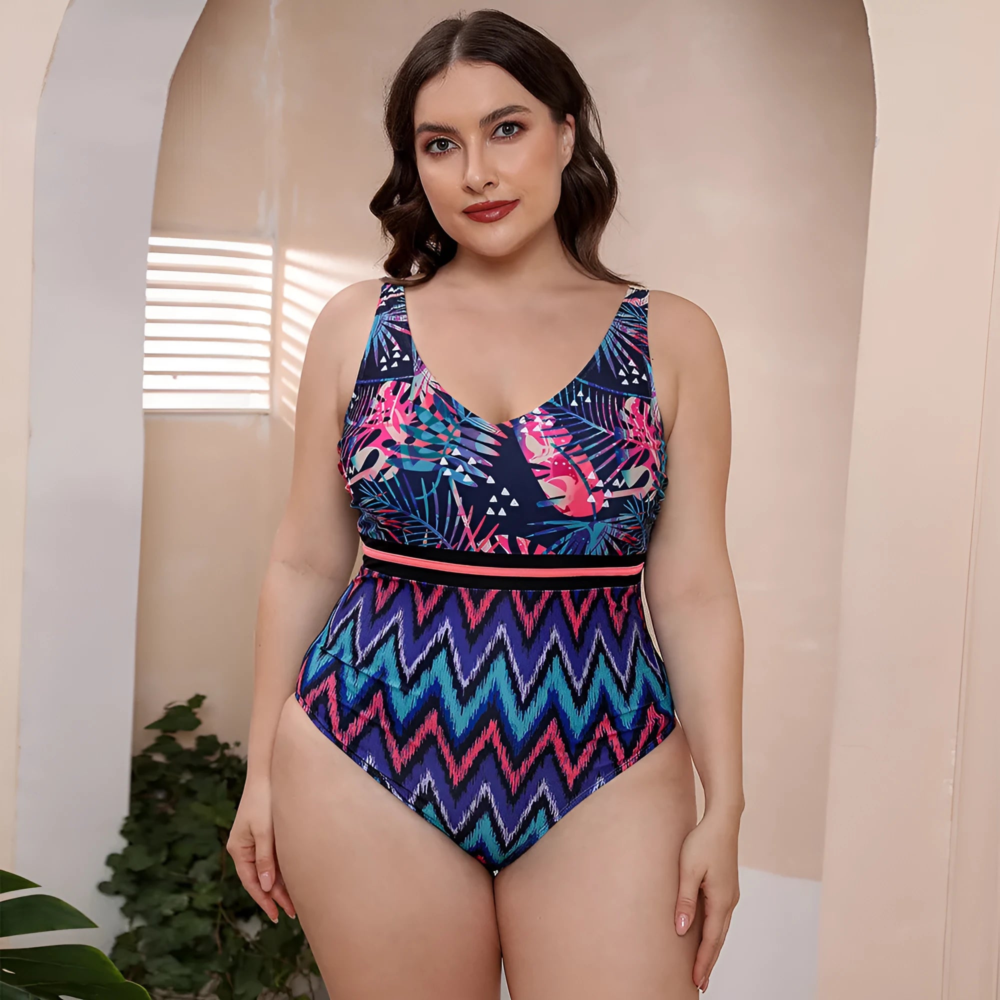 Women's blue printed one-piece swimsuit with spaghetti straps and a striped vest style.