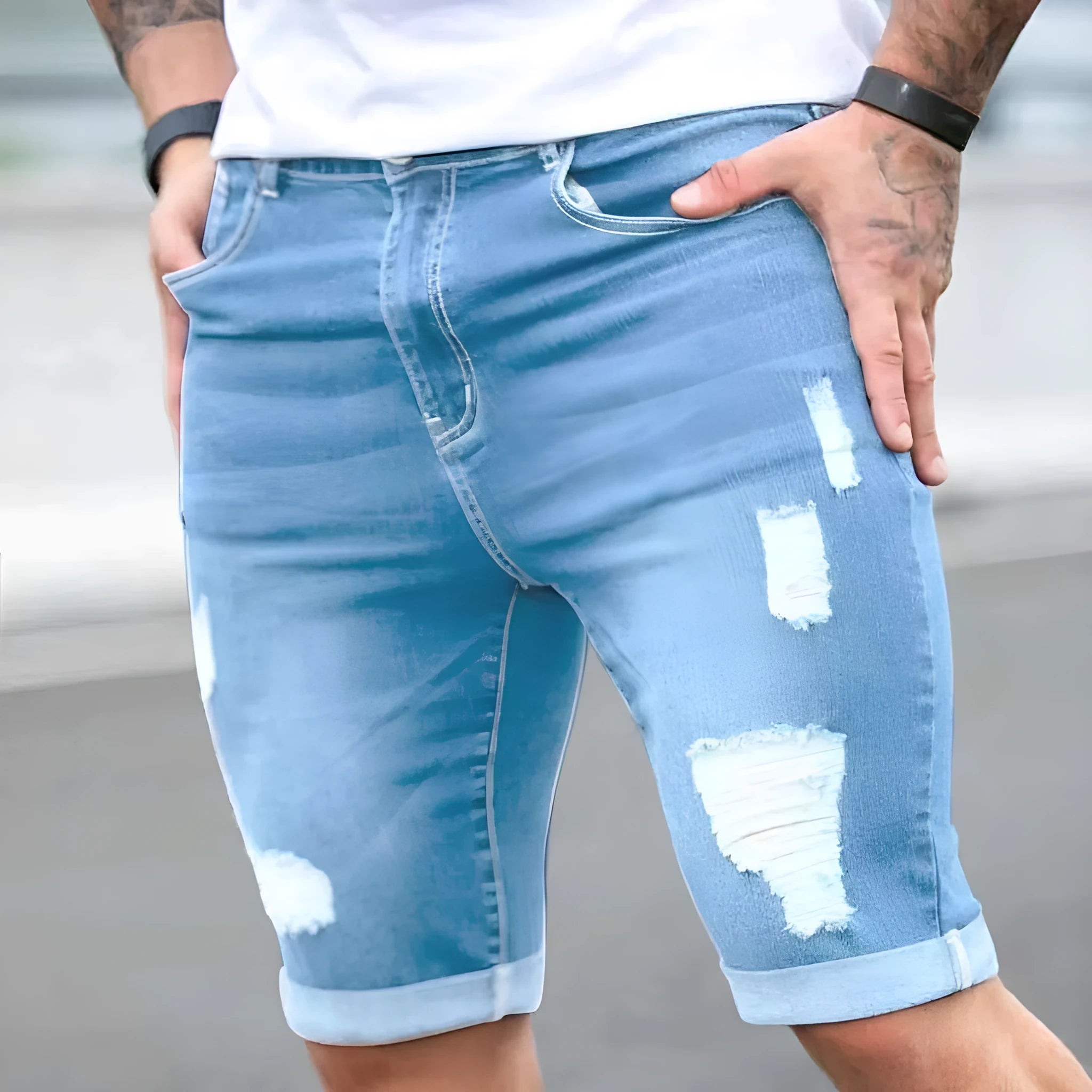 Men's sky blue denim shorts with distressed holes and straight leg cut