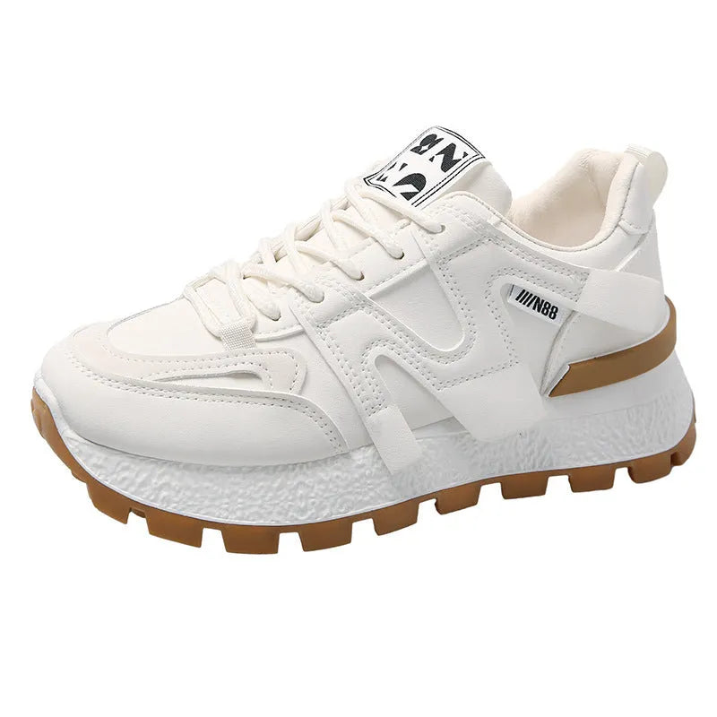A pair of solid-colour low-top sneakers with a round toe and front lace-up, shown in white or black.