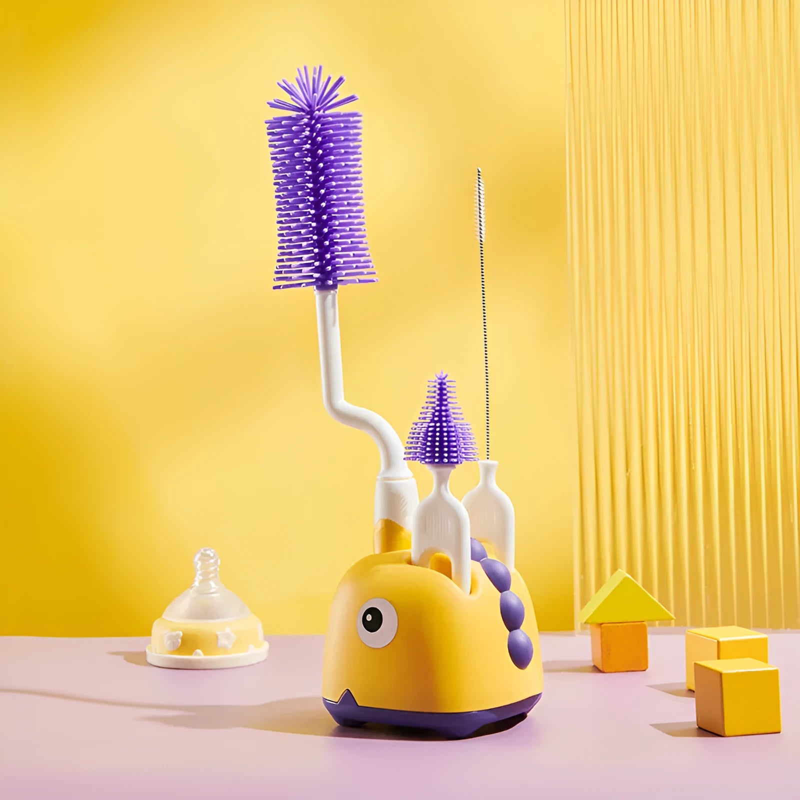 Three multifunctional cleaning brushes in a matching base, amber yellow colour, with PP handles and silicone bristles
