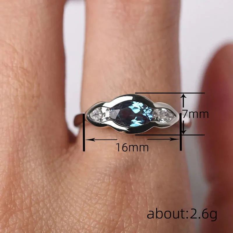 Women's geometric ellipse ring with white gold colour finish and inlaid zircon stones