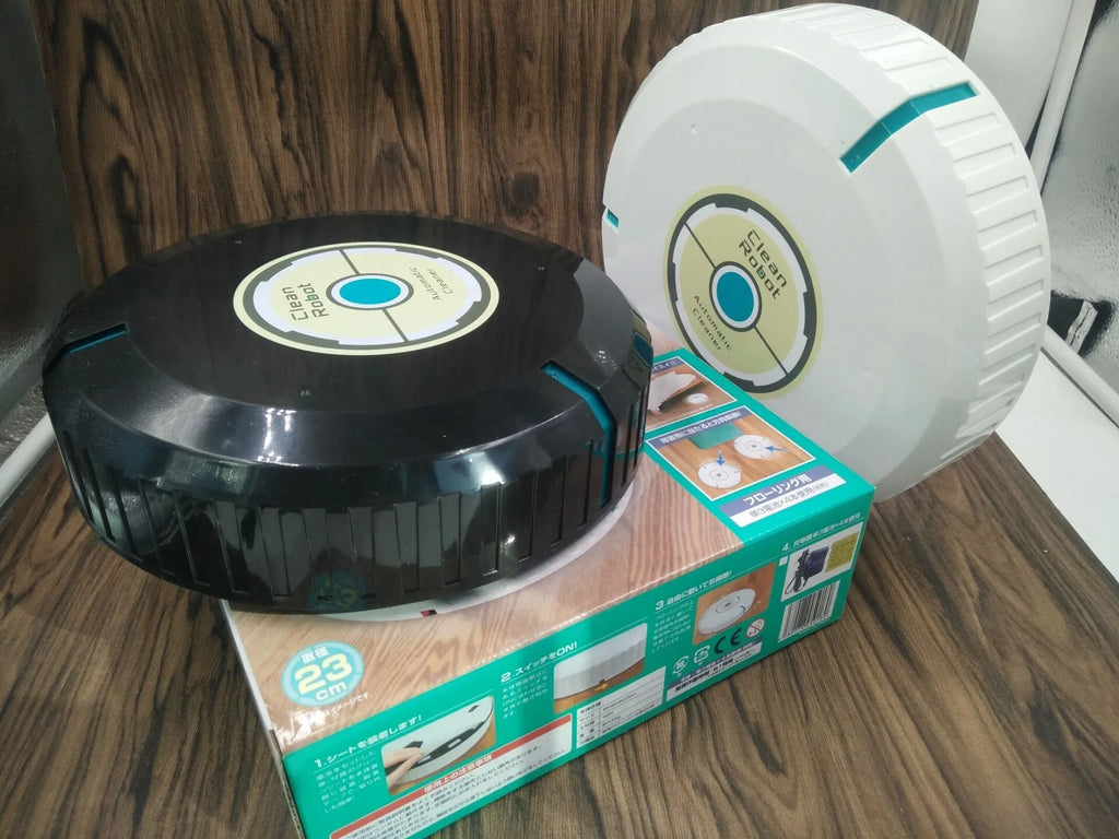 Black and white AC Sweeping Robot automatic vacuum cleaner on a hardwood floor.