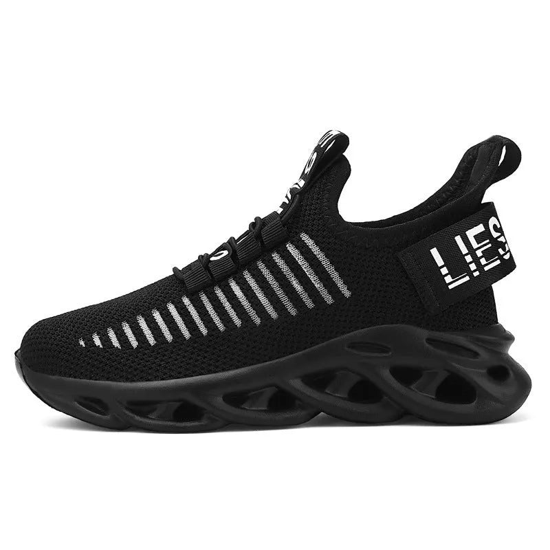 Children's black coconut sneakers with Velcro strap and fabric upper.