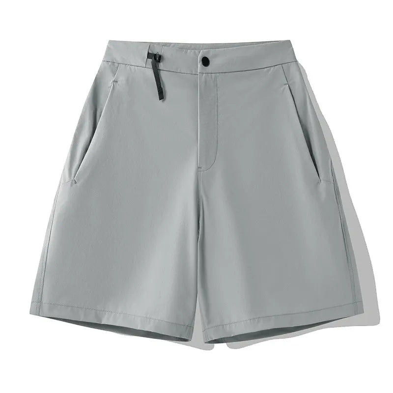 Men's khaki quick-drying sports shorts with elastic waist and 3D cut design for running and outdoor activities.