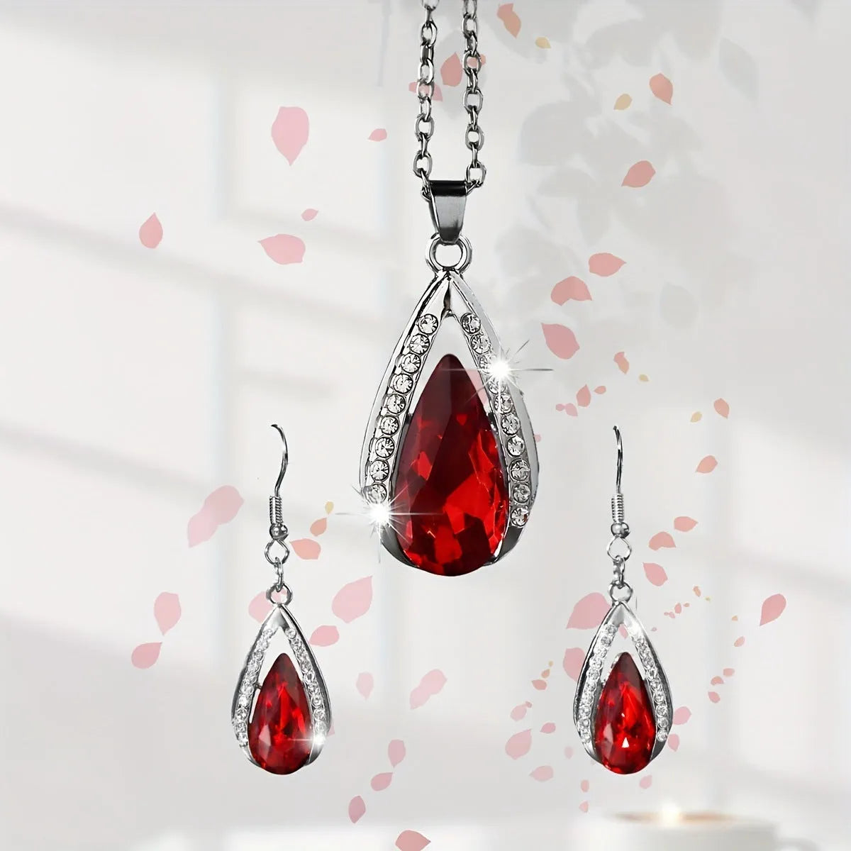 Black and red teardrop pendant necklace with matching earrings in alloy