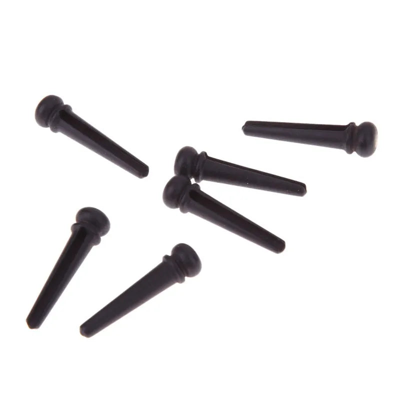 Six matt black ebony guitar string nails for folk acoustic guitars