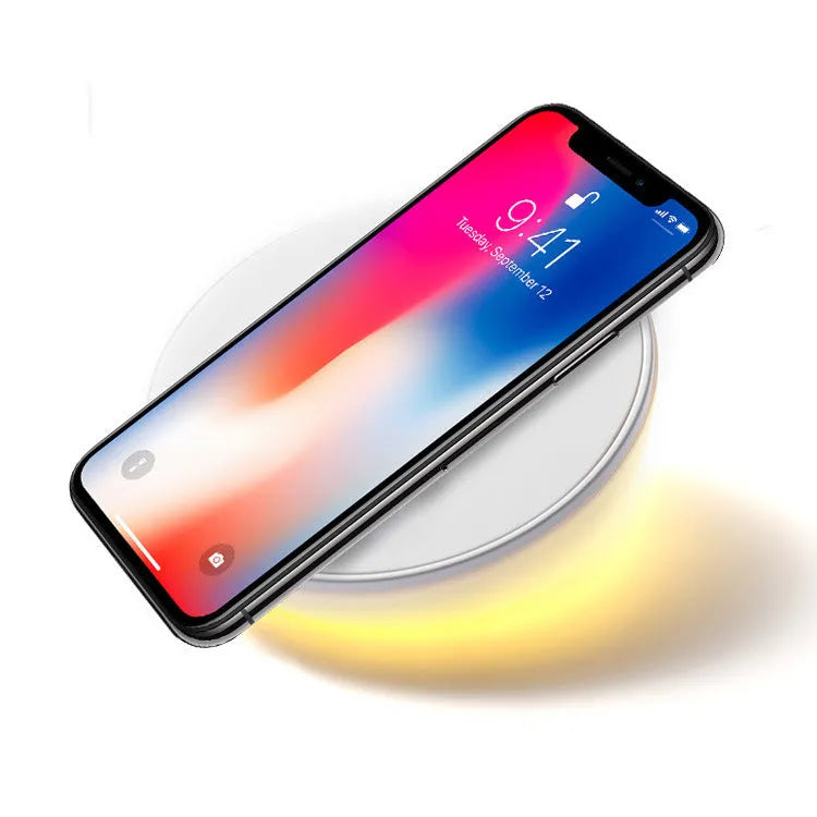 White Qi wireless charging pad with LED digital clock display and three control buttons