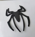 Three-dimensional metal spider car bumper sticker in zinc alloy, shown in gold colour.