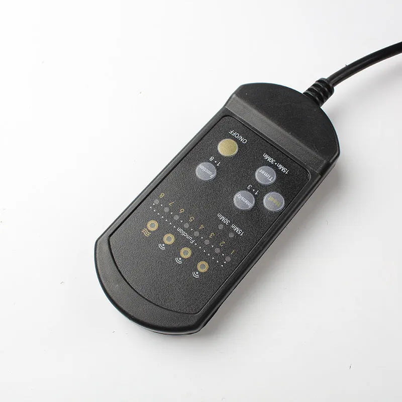 Black heating massage mat with infrared physiotherapy and variable speed control on seat cushion