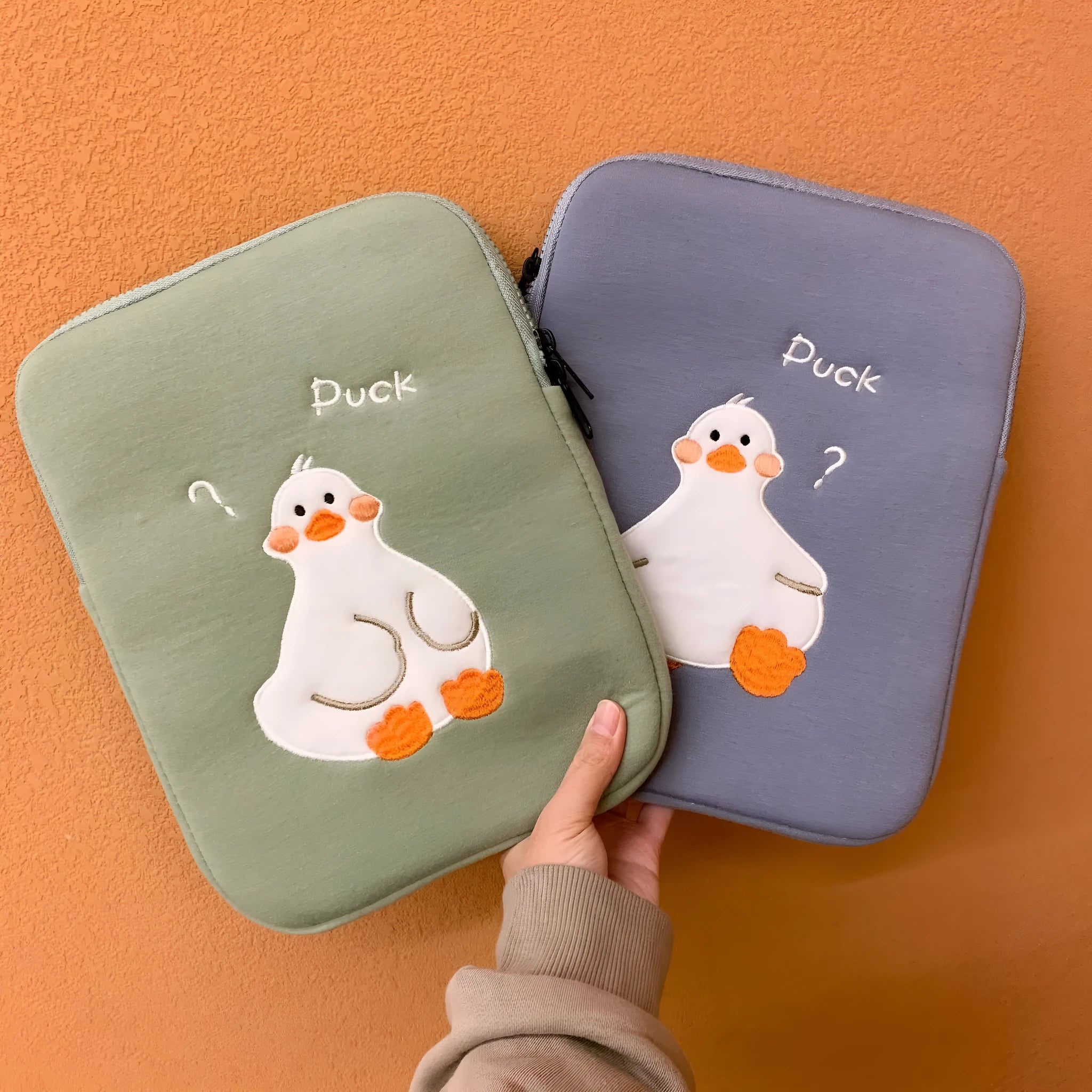 Cotton tablet case with cartoon duck embroidery design in blue or green colours with zipper closure