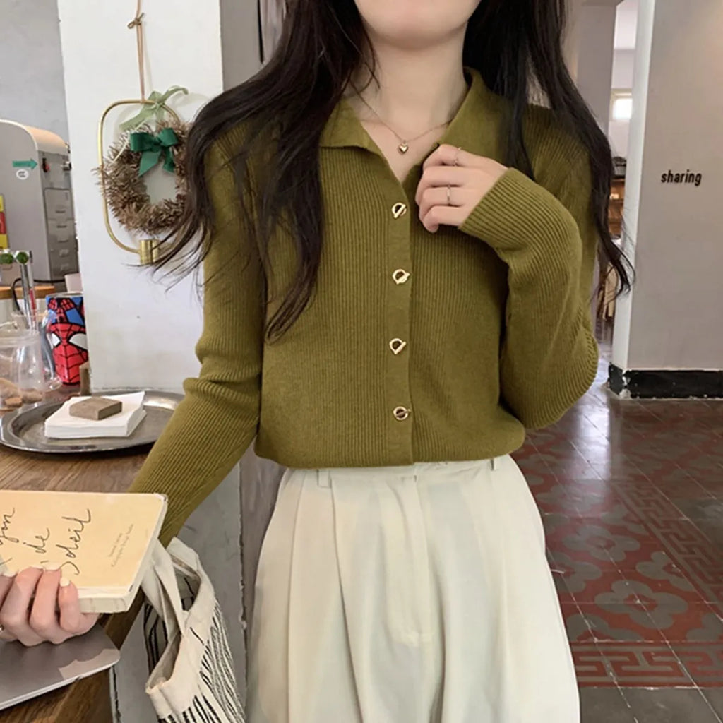 Loose-fitting knitted cardigan in viscose fibre showing long sleeves and neutral colour options
