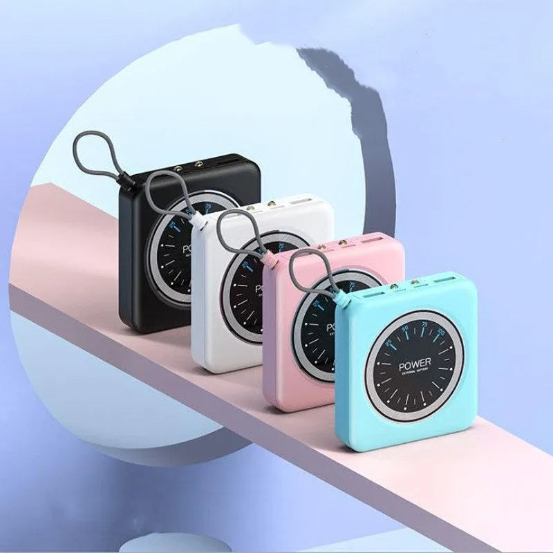 Compact alloy mini clock power bank charger in mint green with multiple USB output ports.