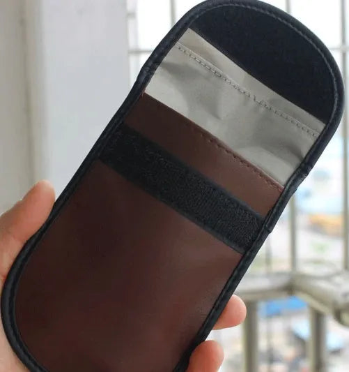 Black microfiber RFID blocking bag measuring 13.5 by 9.5 centimetres with Faraday cage signal protection