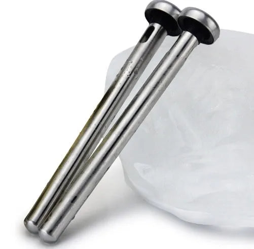 Silver stainless steel wine cooling rod with pourer next to a red wine bottle