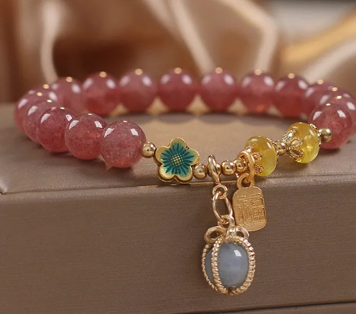 Red strawberry quartz beaded bracelet with alloy metal accents and rhinestone decorative details for women