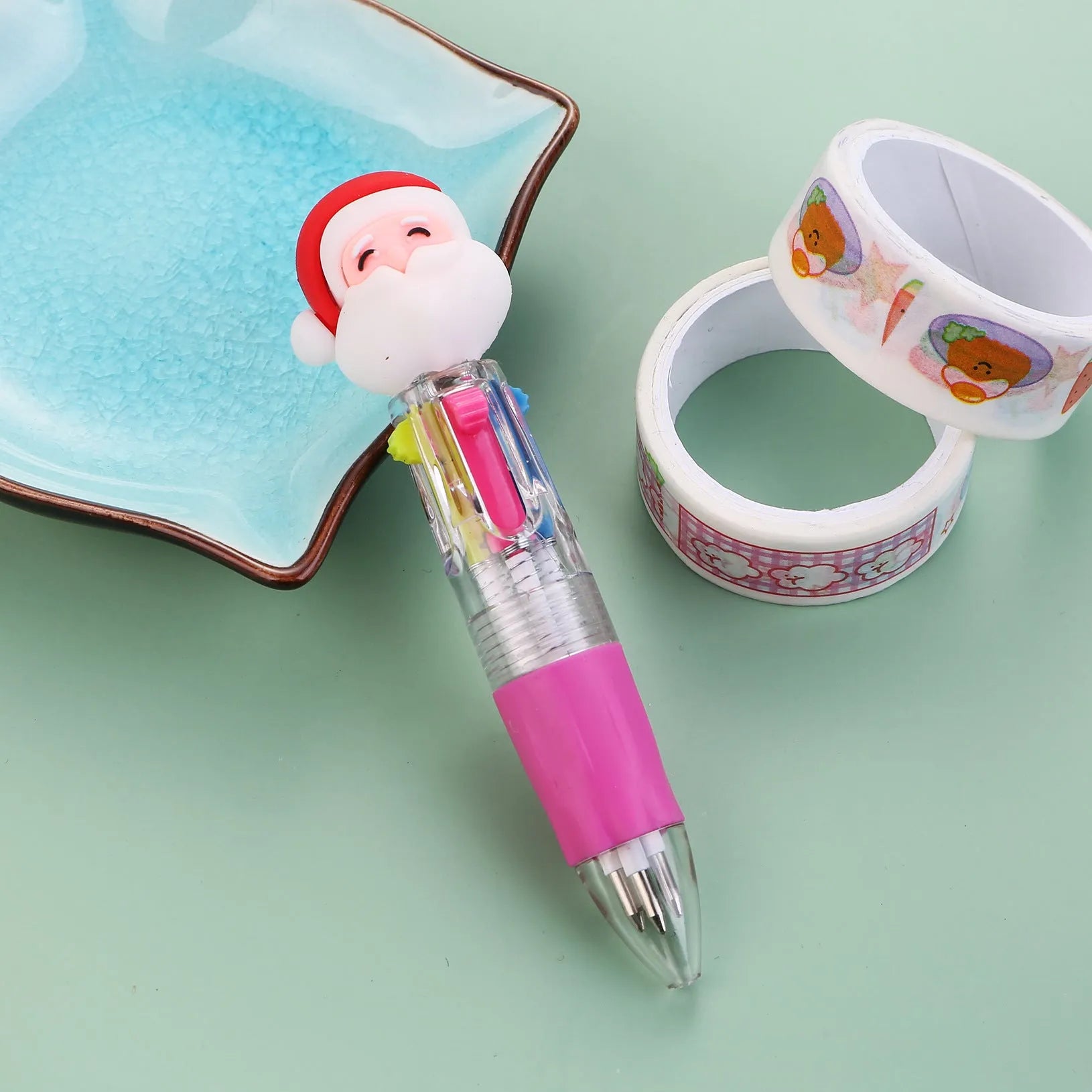 Christmas mini four-colour press-action ballpoint pen with festive designs measuring 11 cm.