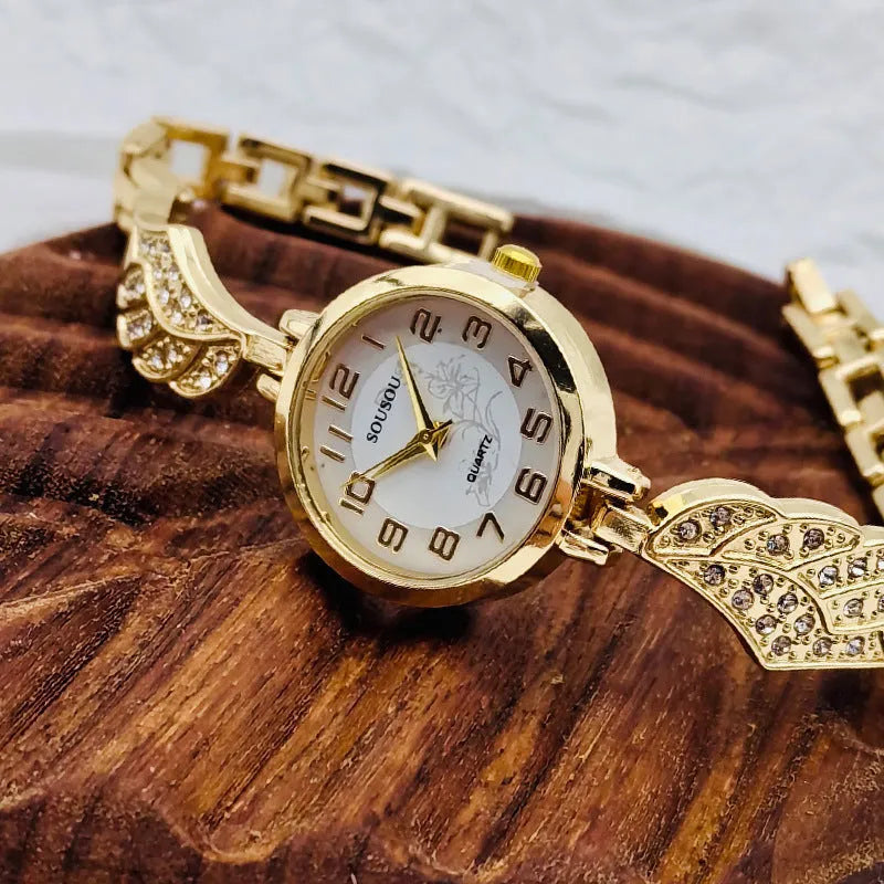 Women's stainless steel fashion watch with round dial showing gold surface option