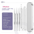 Four metal acne needles with ultra-fine pointed tips laid out in a set.