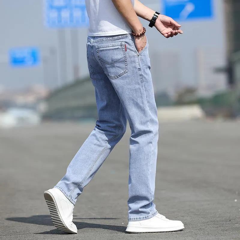 Men's autumn smoky grey straight leg jeans with high elasticity and low waist design