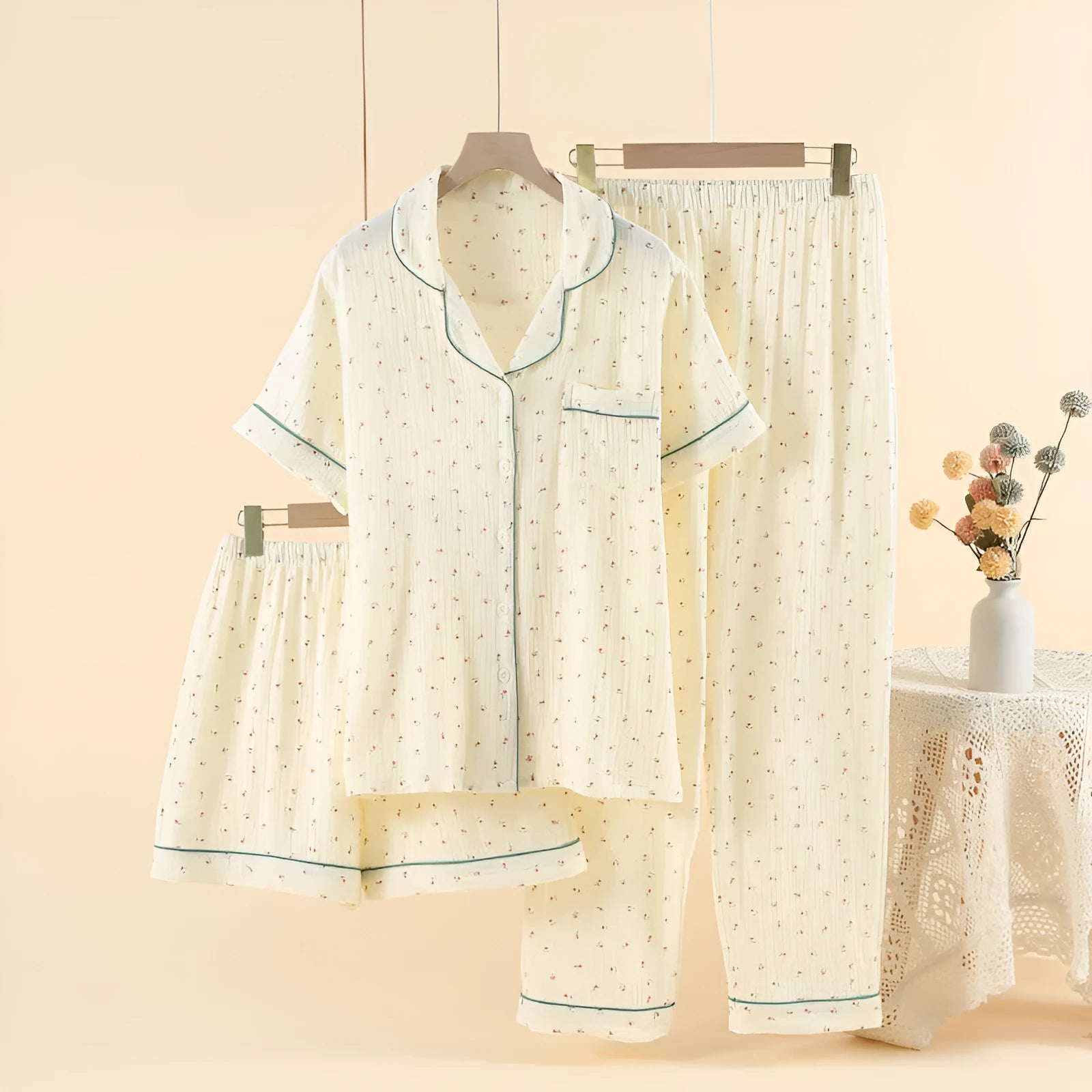 Women's garden gold cotton crepe three-piece pajama set with lapel top and trousers.