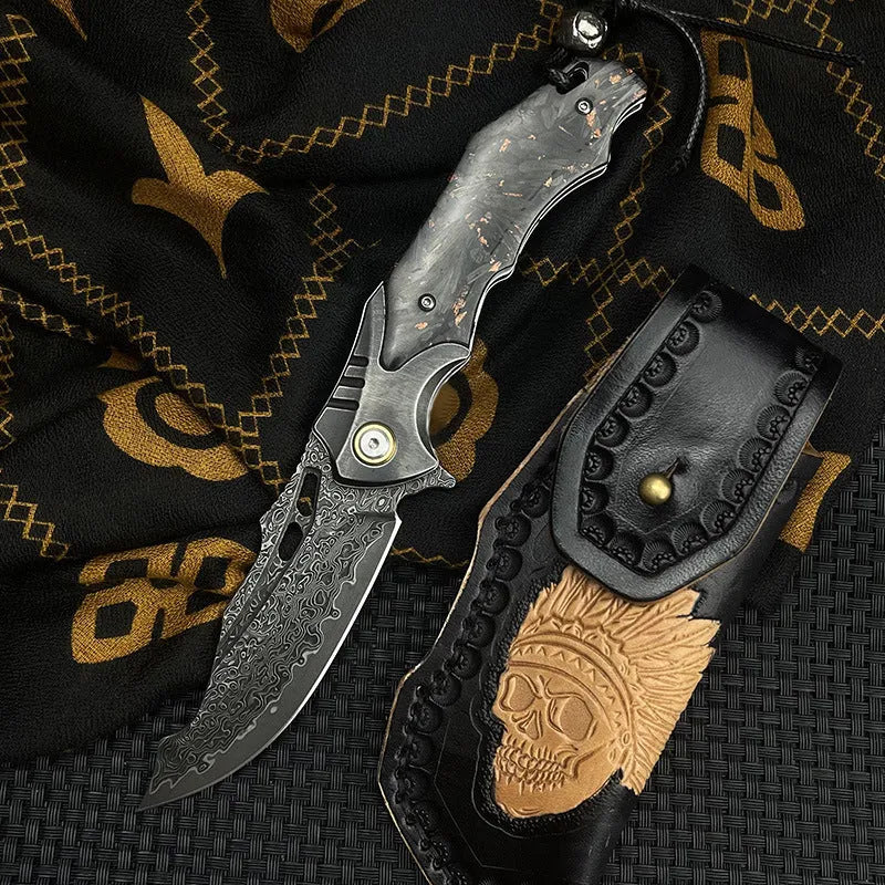 Damascus steel folding knife with carbon fibre handle and 9cm VG10 blade open on wood surface
