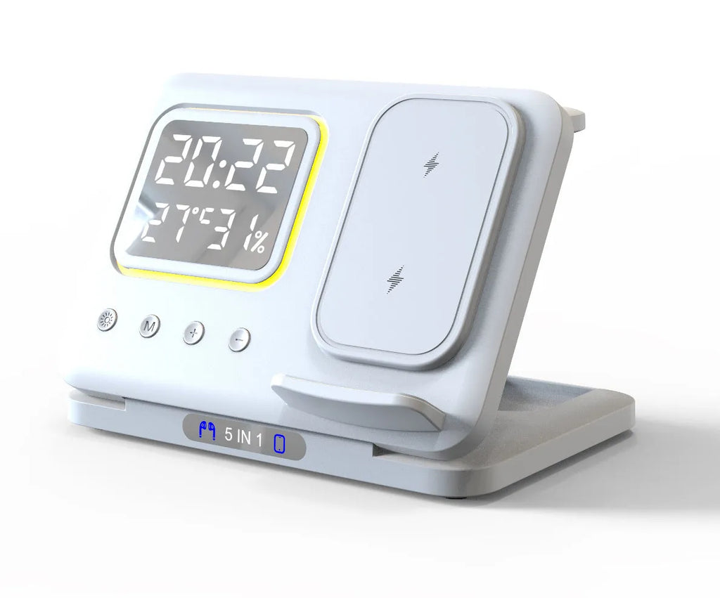 Black and white 5-in-1 wireless charging dock station with phone, watch and earphones charging, showing LED clock display.