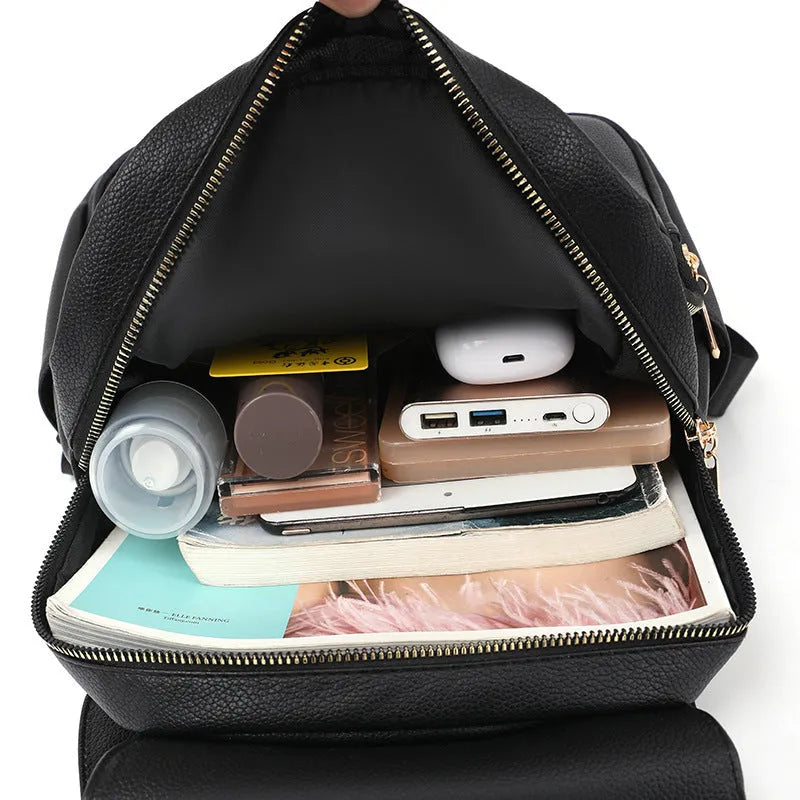 Women's PU leather backpack in black, blue, or taro purple with three-dimensional pockets