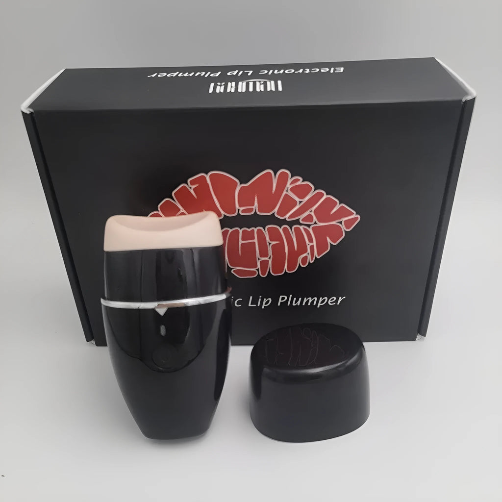 Black and white electric lip plumper device with silicone tip and USB cable on a plain background.