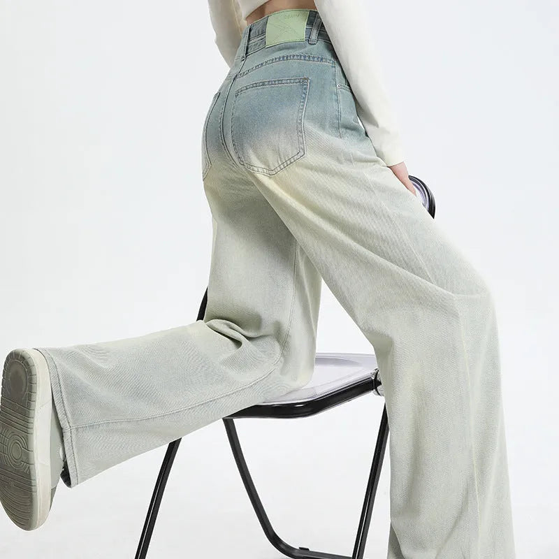 Women's gradient blue denim straight-leg trousers with wide-leg styling on size chart background