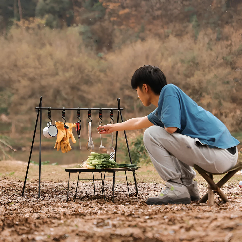 Large foldable aluminium alloy triangle clothes drying rack for camping with side hooks.