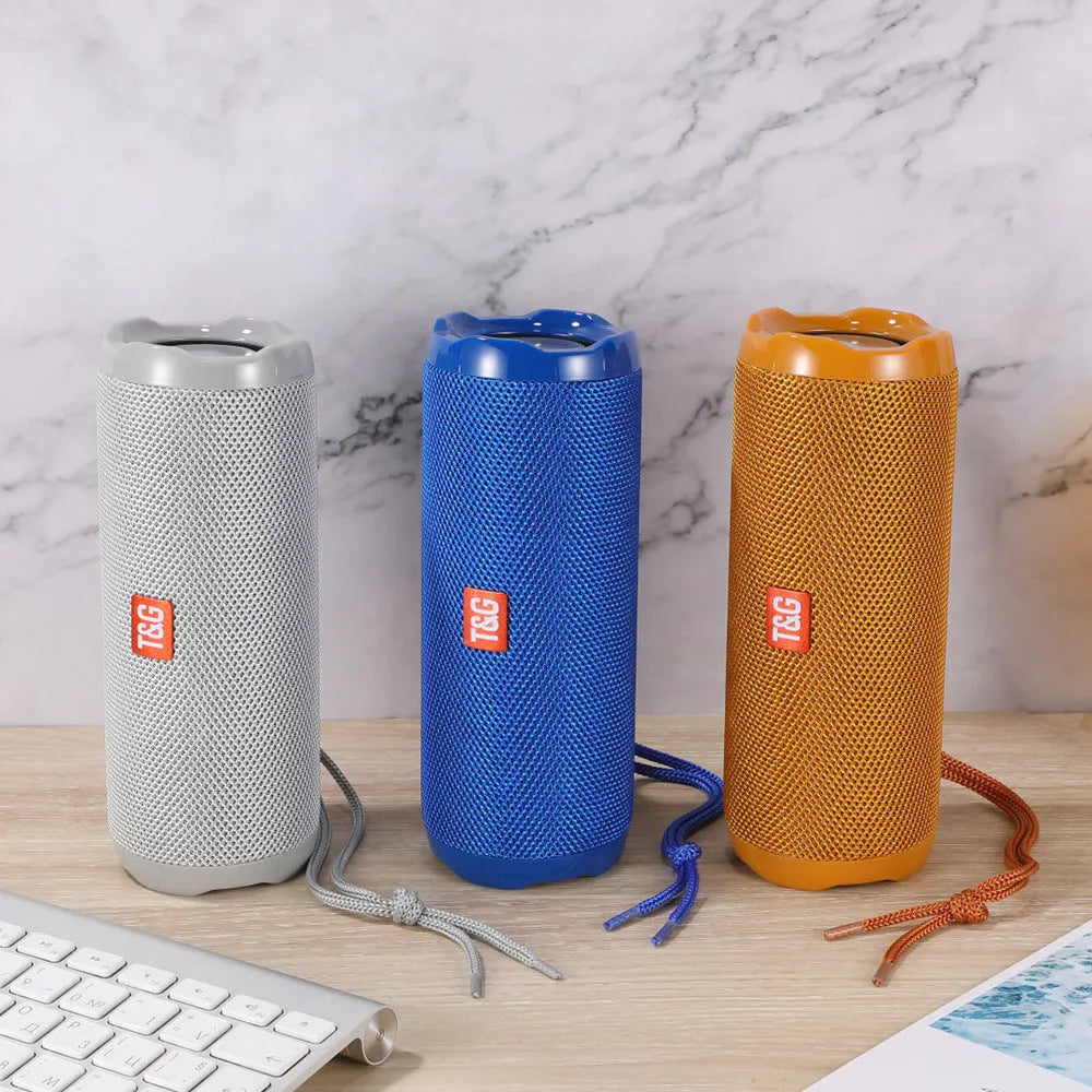 Fabric-covered portable Bluetooth speaker with card holder slots in multiple colour options