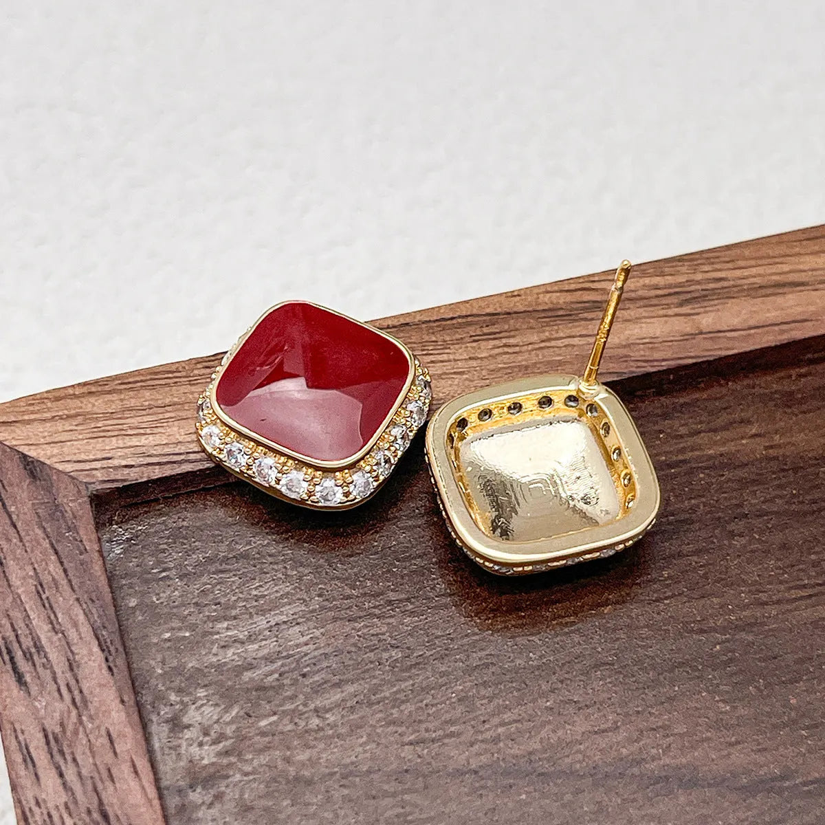 Red square alloy earrings with geometric inlaid design and sweet-cool hybrid style