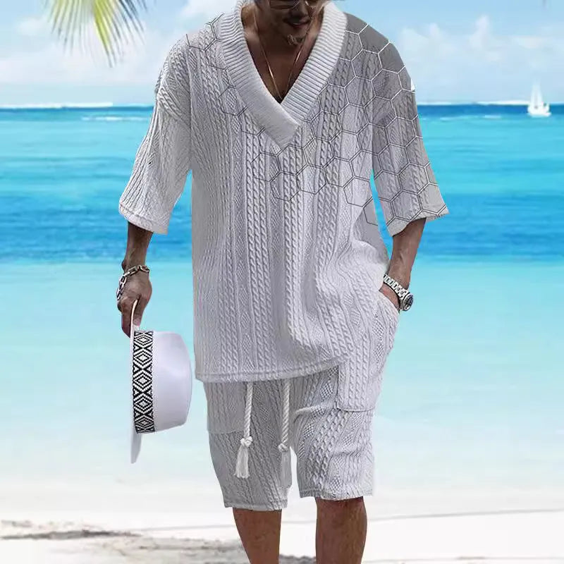 Men's printed drop-shoulder knitted short-sleeved top and matching shorts suit in a polyester blend fabric.