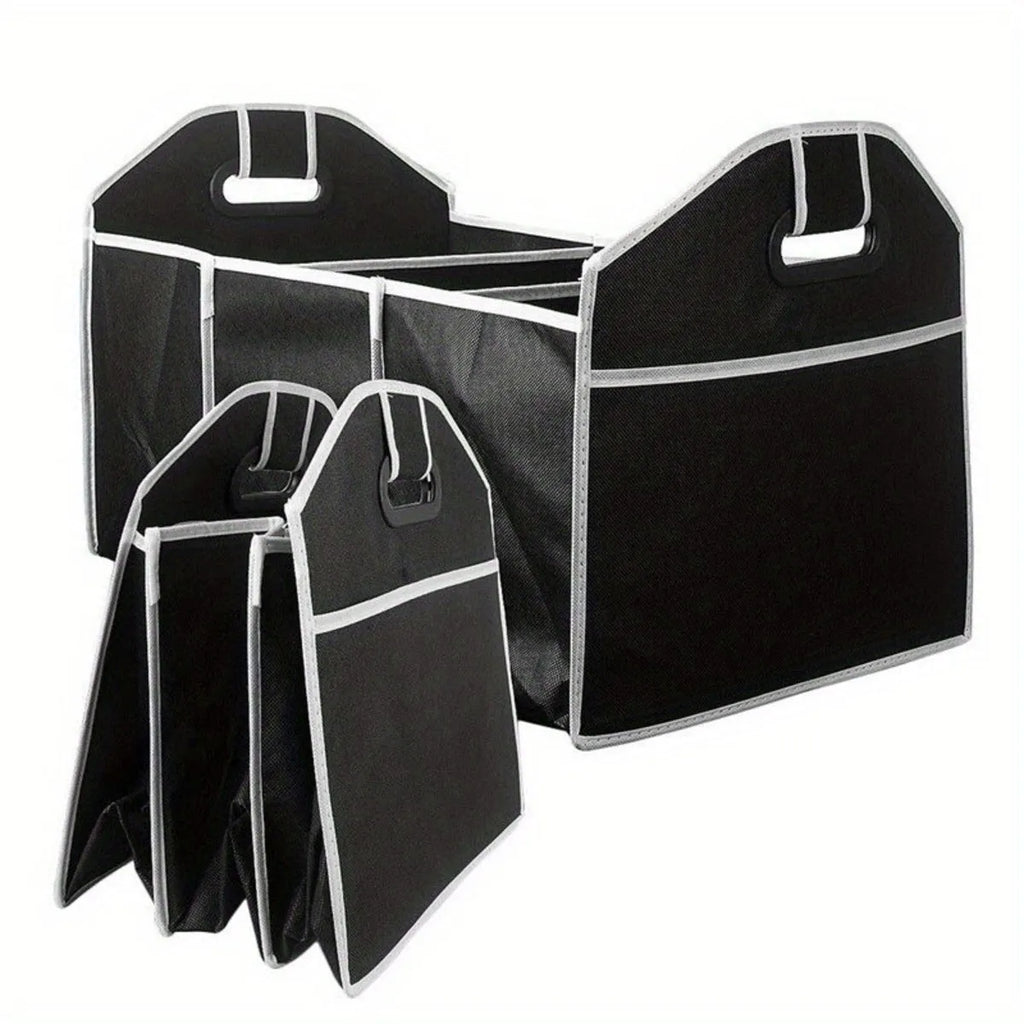 Black car multi-pocket trunk organiser with foldable lid and tie-down straps on car boot floor