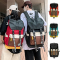 Oxford cloth backpack in black showing handheld strap and shoulder straps