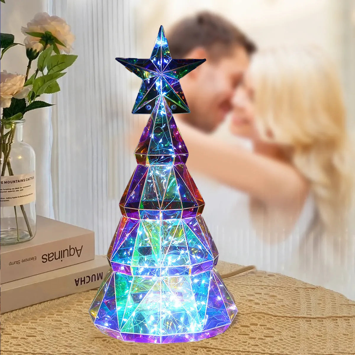 Colourful cartoon-style LED Christmas tree decorative toy on a tabletop