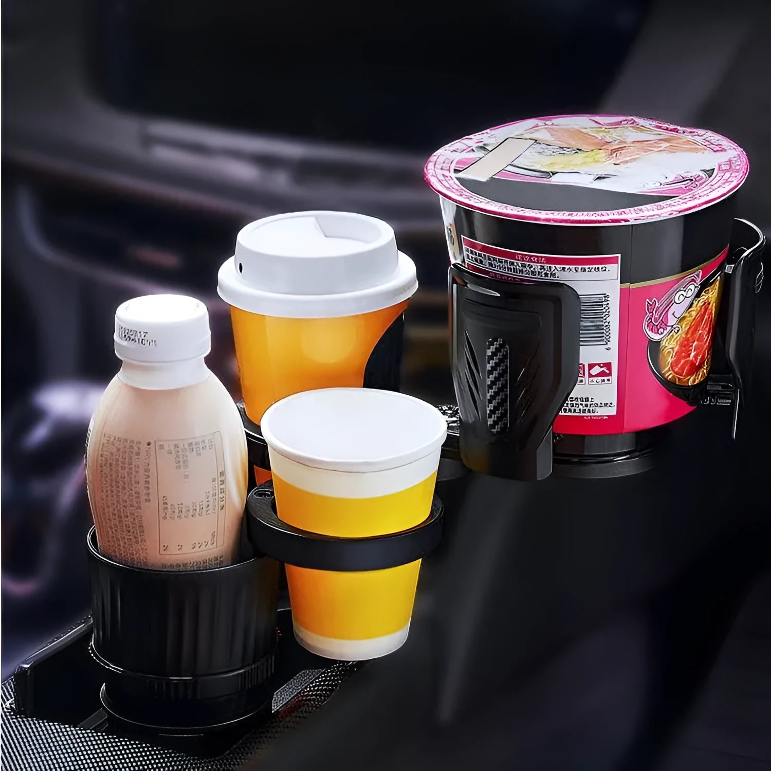 Black carbon fibre adjustable car cup holder with retractable base on a 6.5-10 cm range.