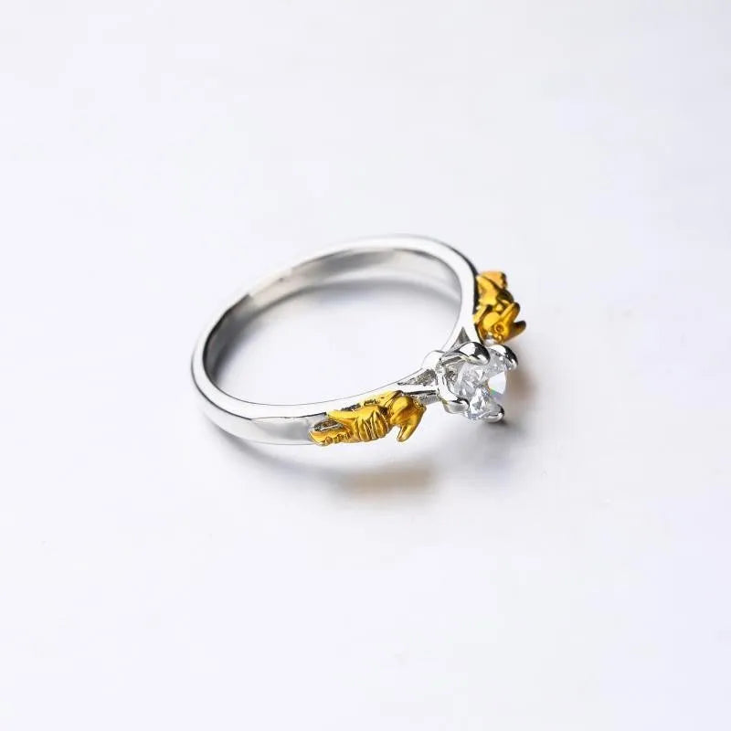 Copper crown cosplay ring with black gold finish and crystal details on a hand.