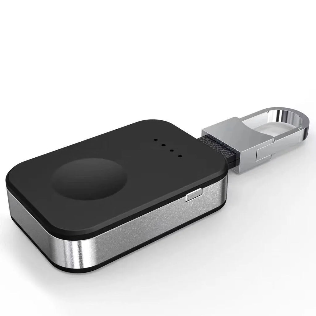 Black Apple Watch portable wireless charger keychain with USB port on a keyring.