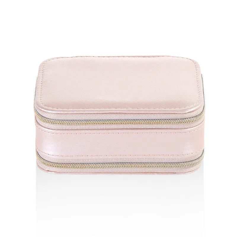 Light blue PU leather zipper jewellery box on a flat surface, compact 11.5x8.5x5cm size