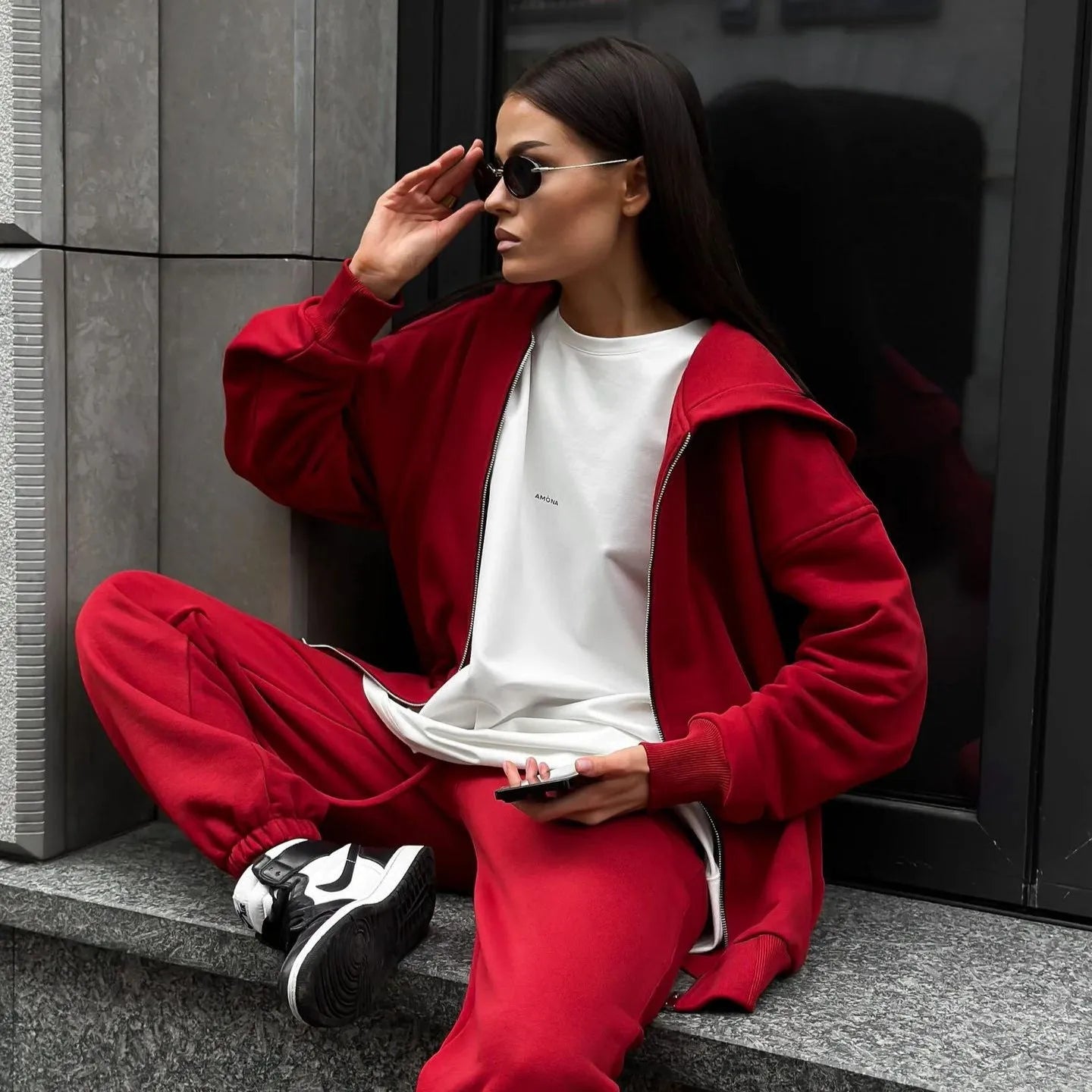 Red loose fit street style coat and trousers two-piece set on a hanger.
